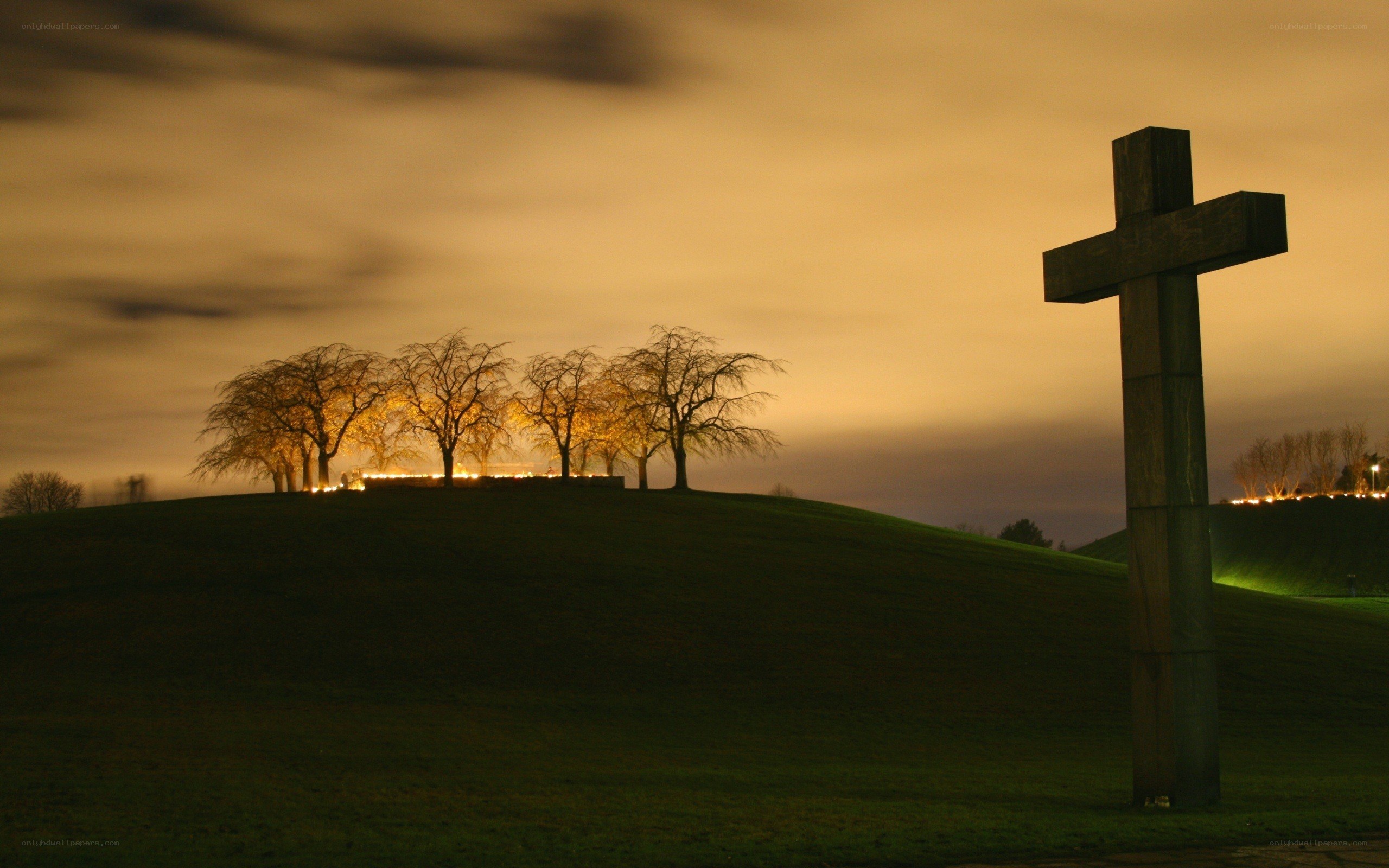 Cross on a hill at dusk
