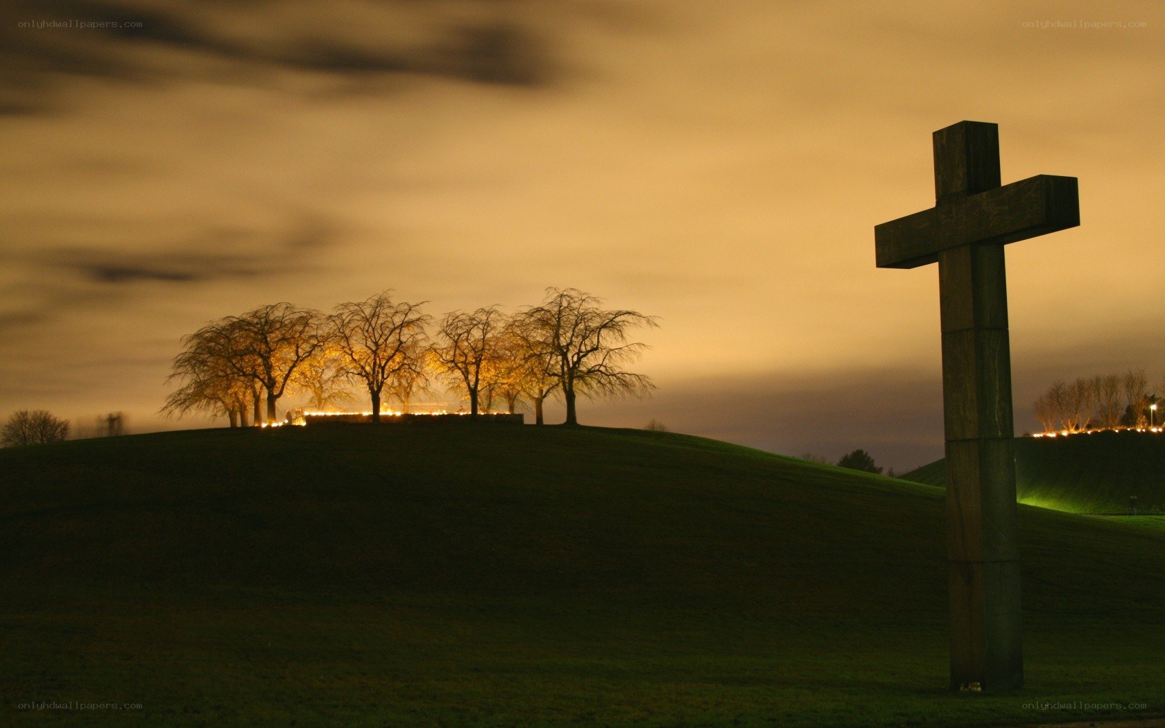 Cross on a hill at dusk