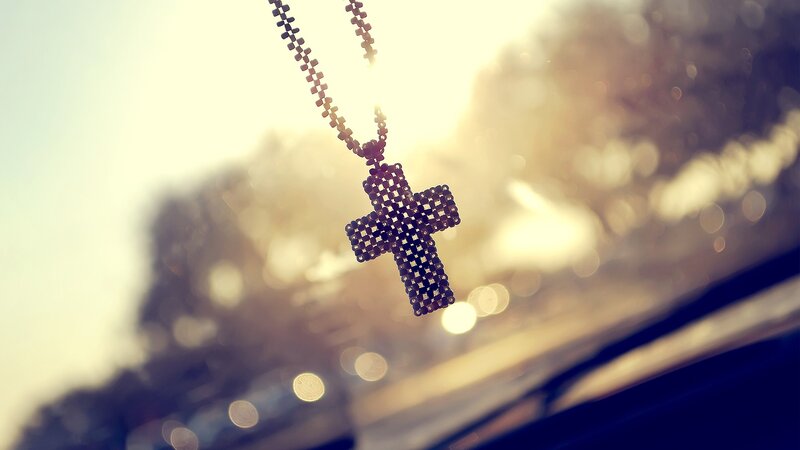 cross pendant in sunlight