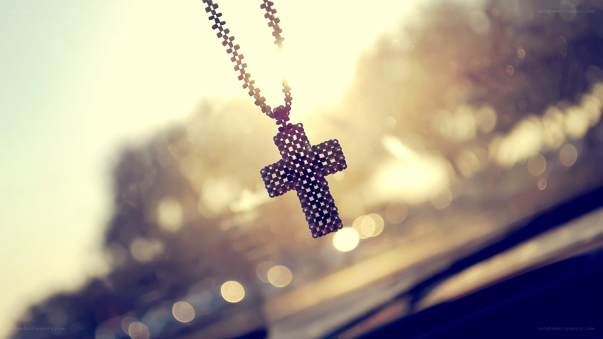 cross pendant in sunlight