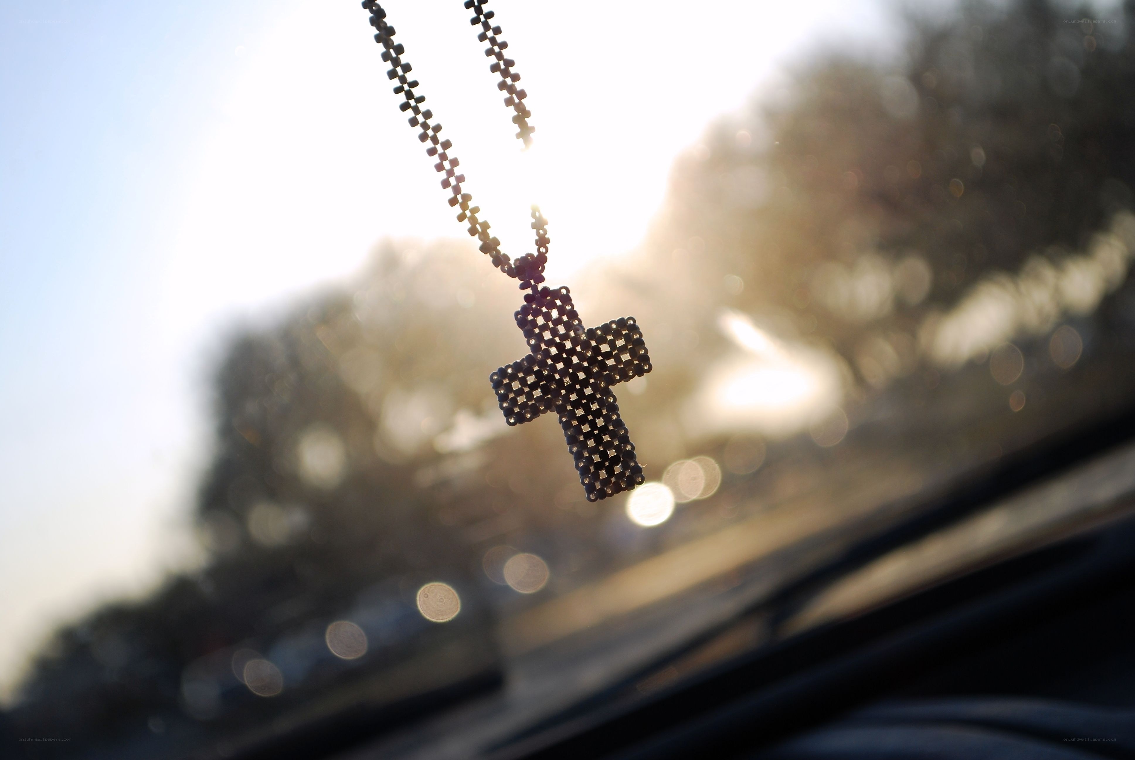 cross pendant in sunlight
