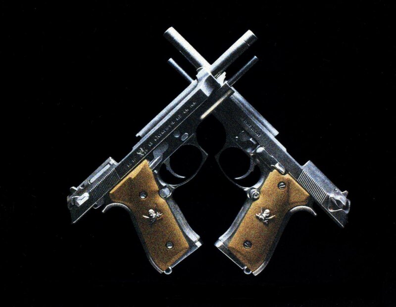 crossed pistols with wooden grips