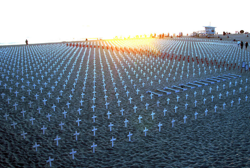Crosses on the beach at sunset