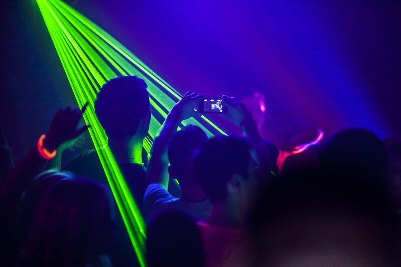 Crowd at a concert with lasers