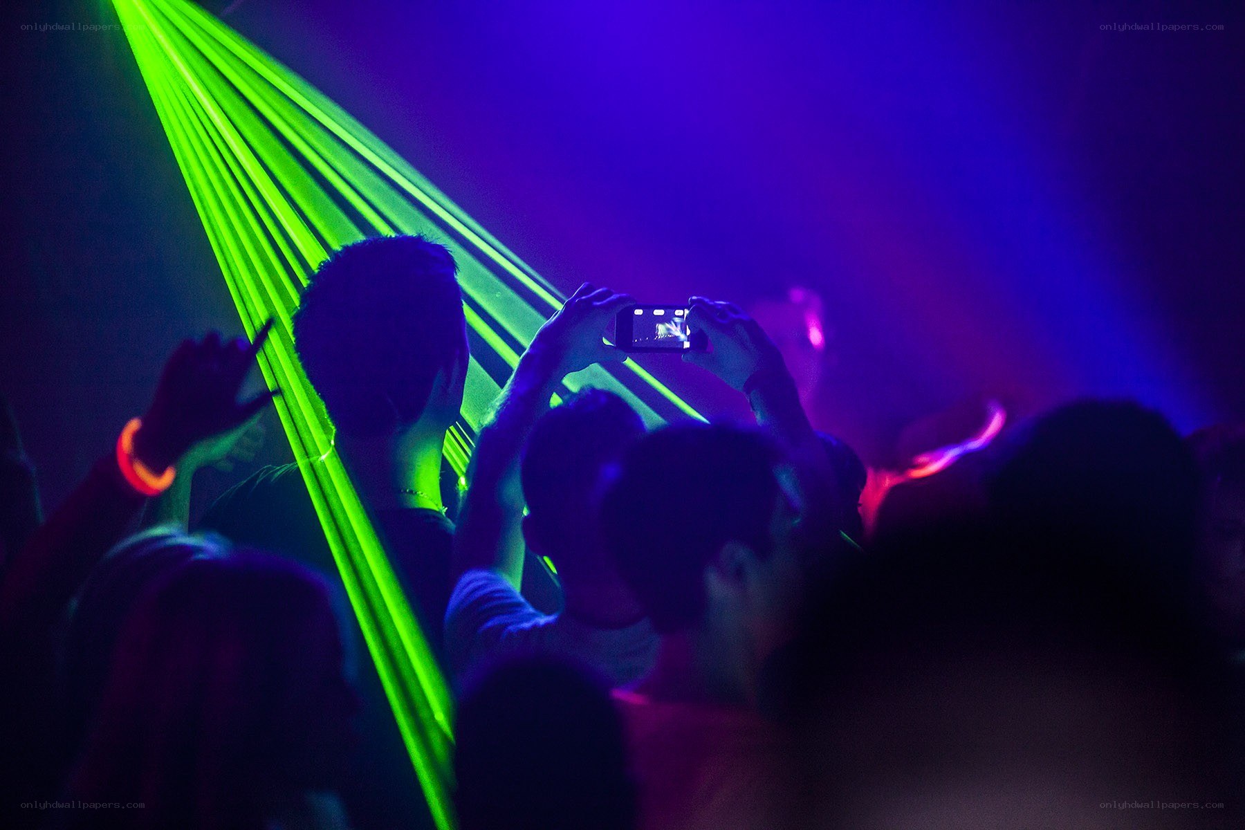 Crowd at a concert with lasers