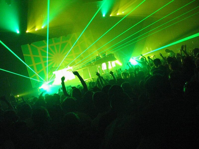 Crowd at a concert with lasers