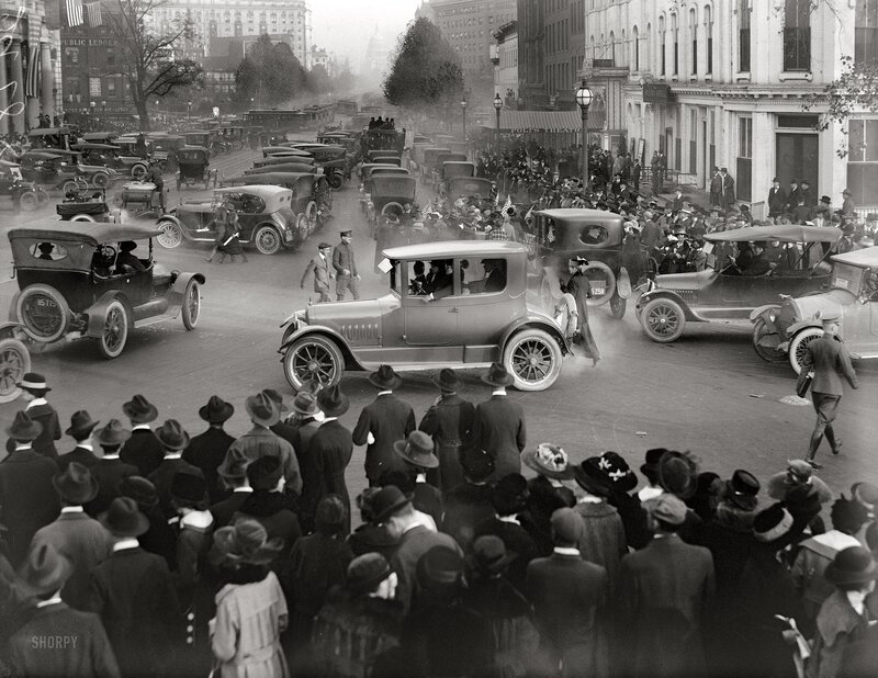 Crowd at car parade in city