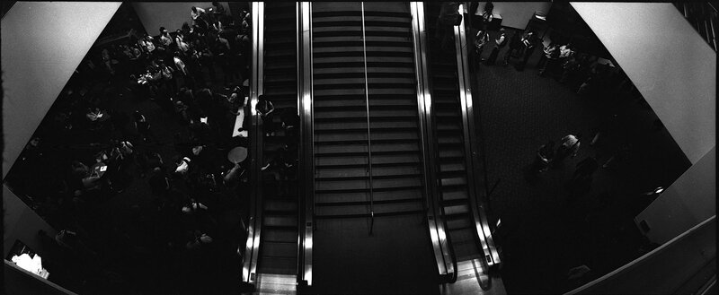 Crowd at escalators from above