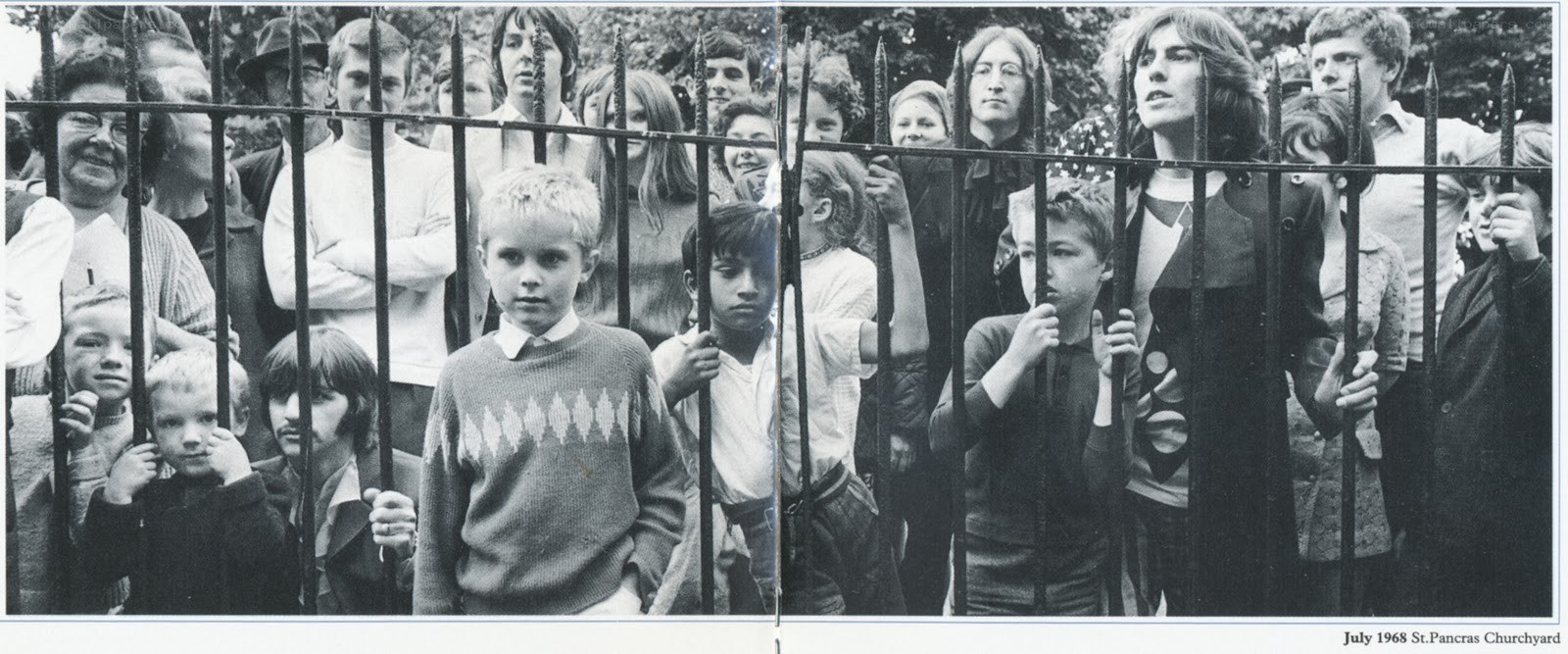 Crowd behind a fence in 1968