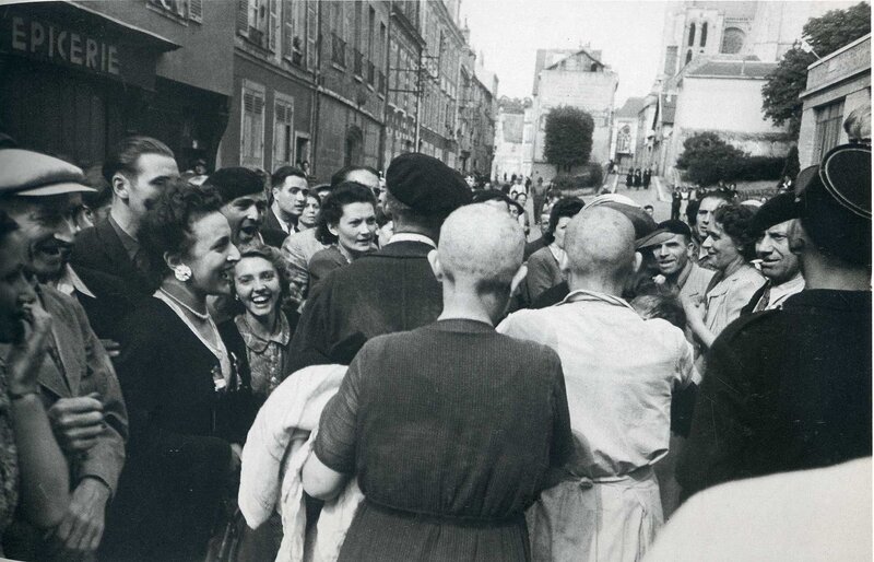 Crowd celebrating in French street
