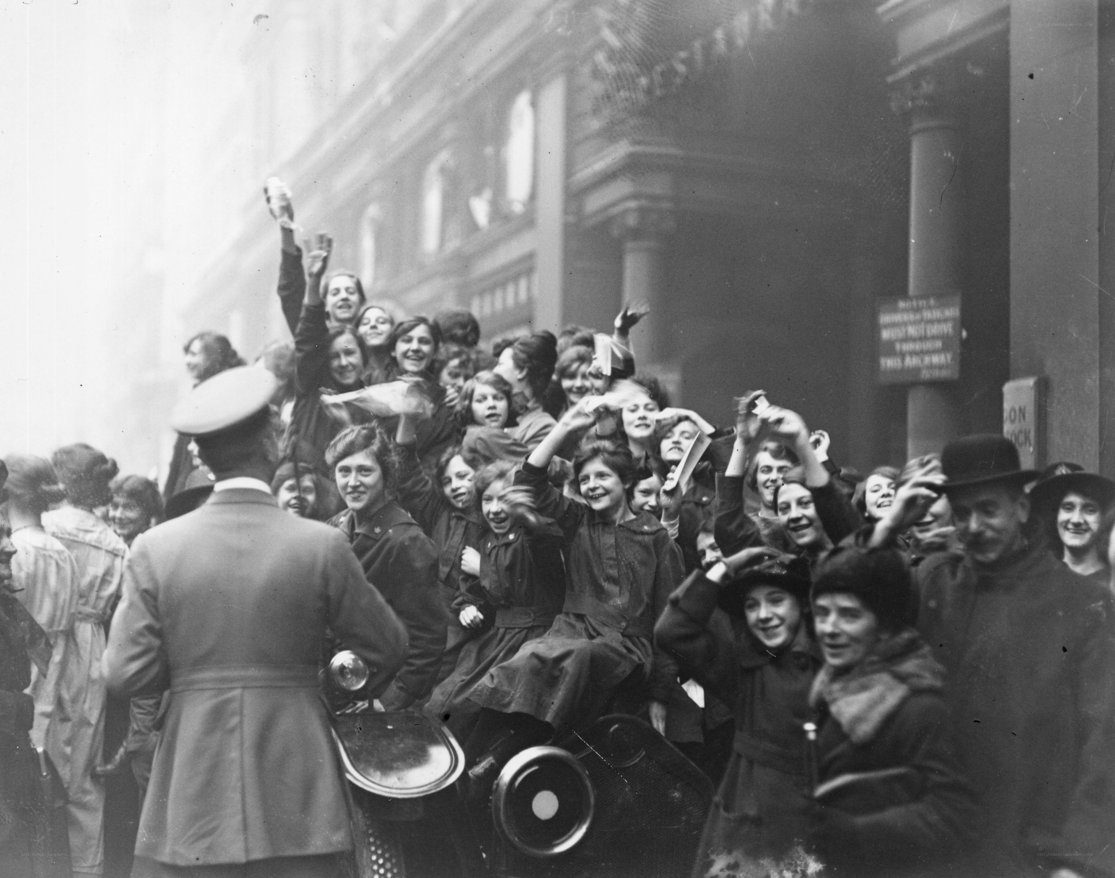 Crowd cheering on a vehicle