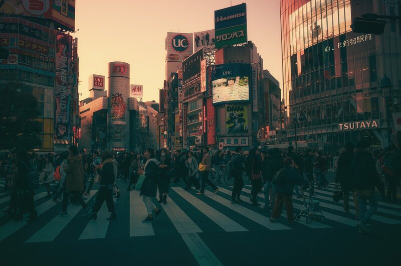 Crowd Crossing Street — Orange