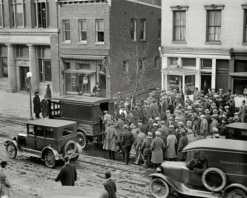 Crowd gathers at street corner