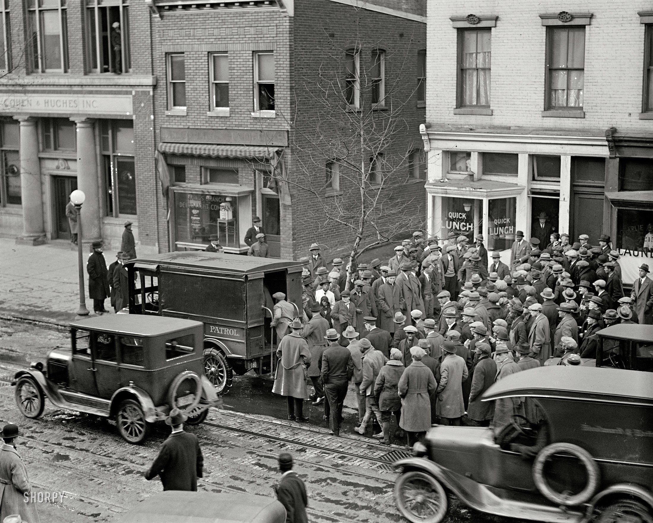 Crowd gathers at street corner