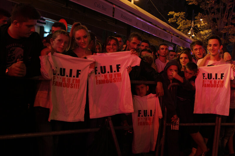 Crowd Holding T-shirts
