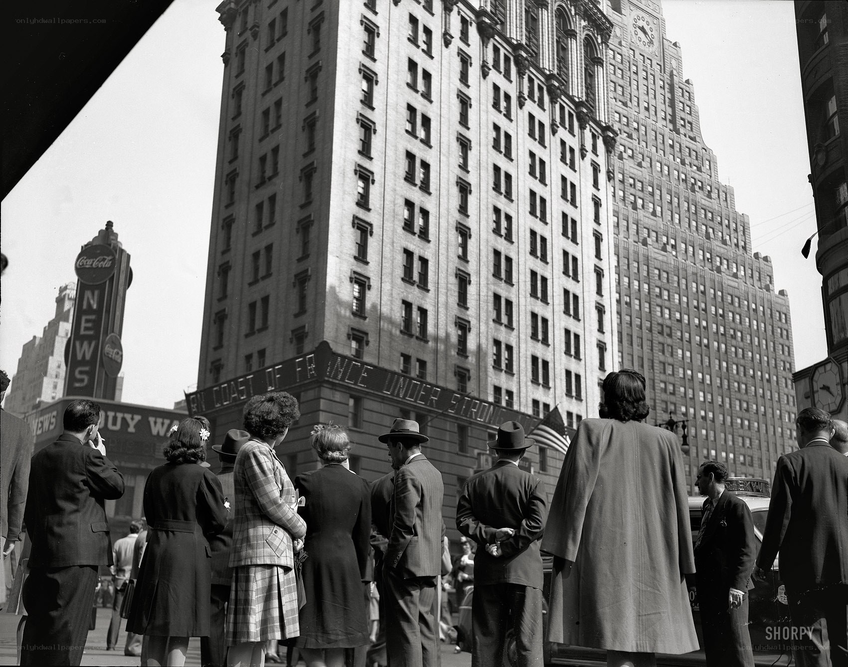 Crowd in front of skyscraper