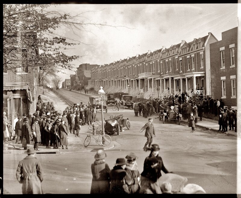 Crowd on a city street in early 1900s
