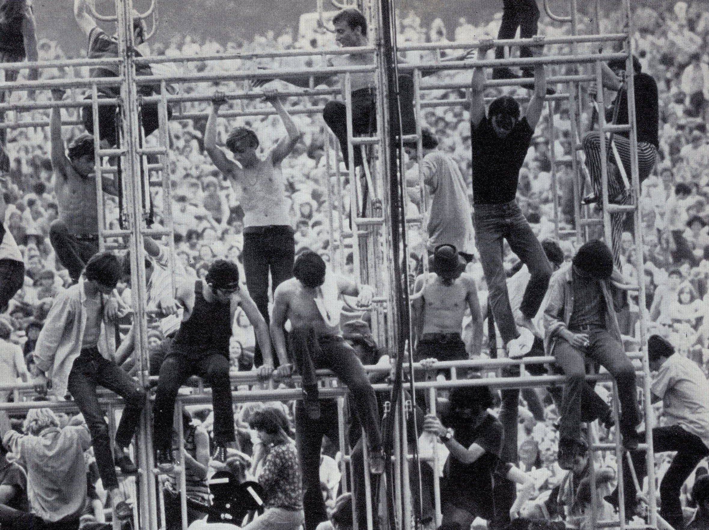 Crowd on metal scaffolding