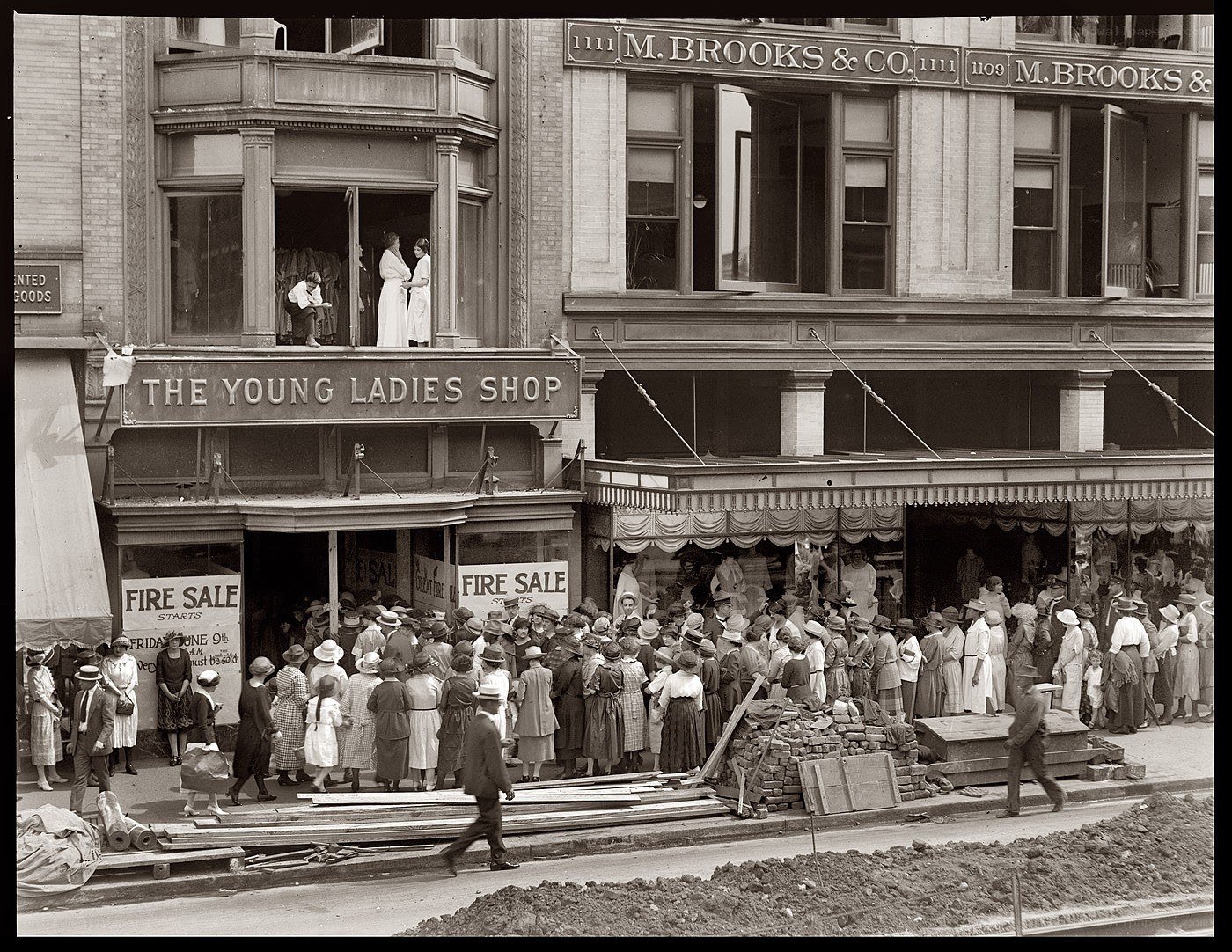 Crowd outside young ladies shop