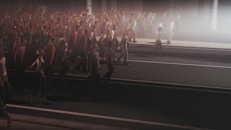 Crowd walking in a dimly lit area