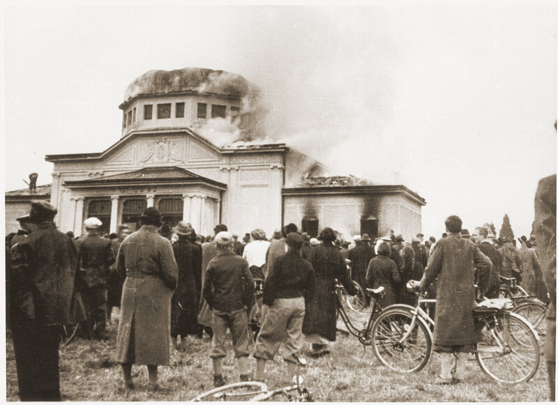 Crowd watching burning building