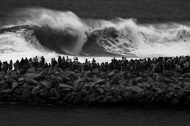 Crowd watching large waves