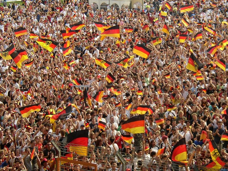 Crowd waving German flags