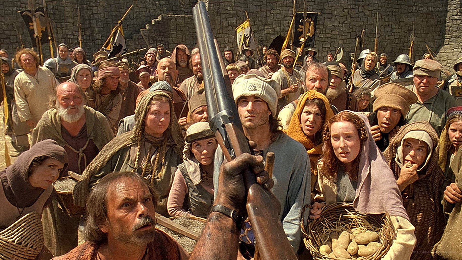 Crowd with rifle in medieval setting