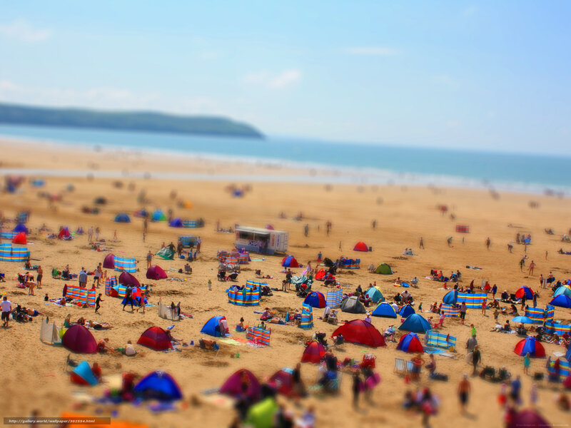 Crowded beach with colorful tents