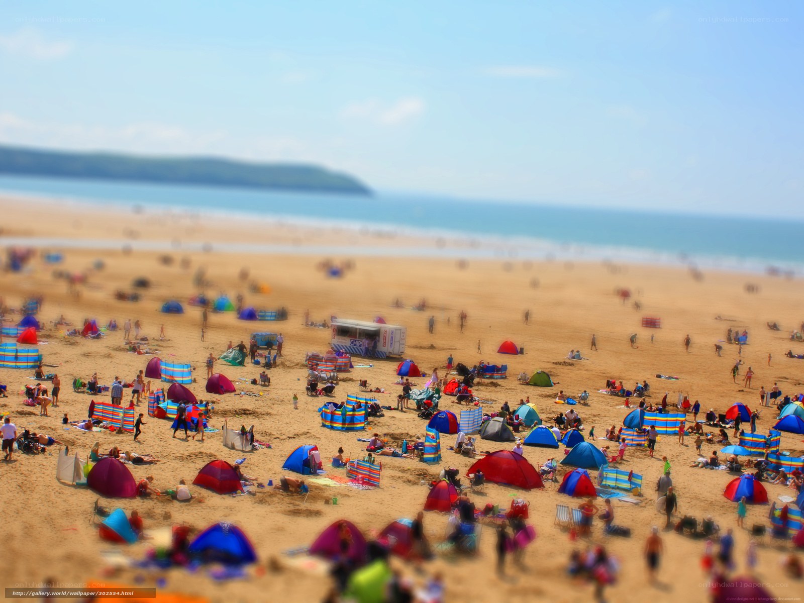 Crowded beach with colorful tents