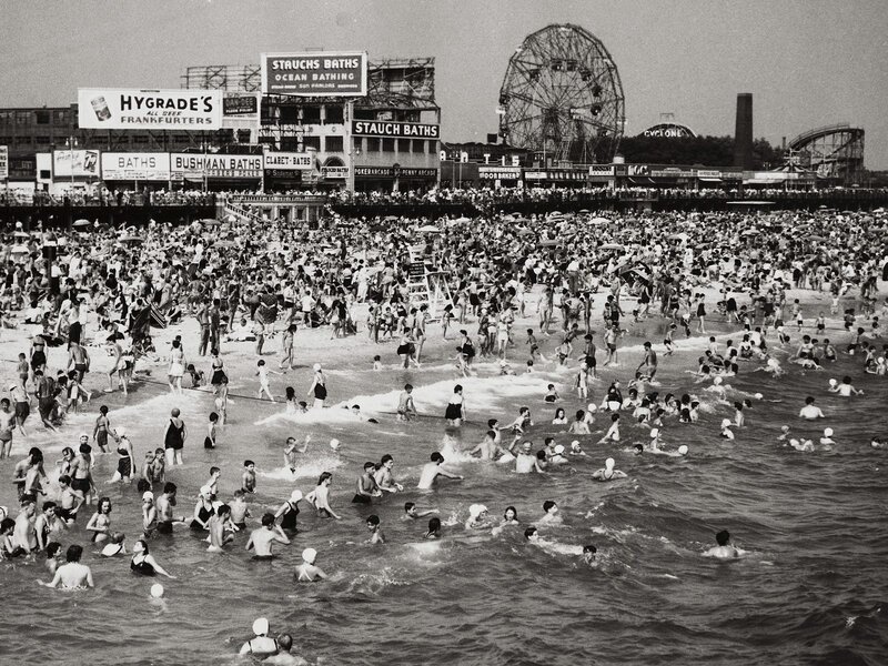 Crowded beach with Ferris wheel