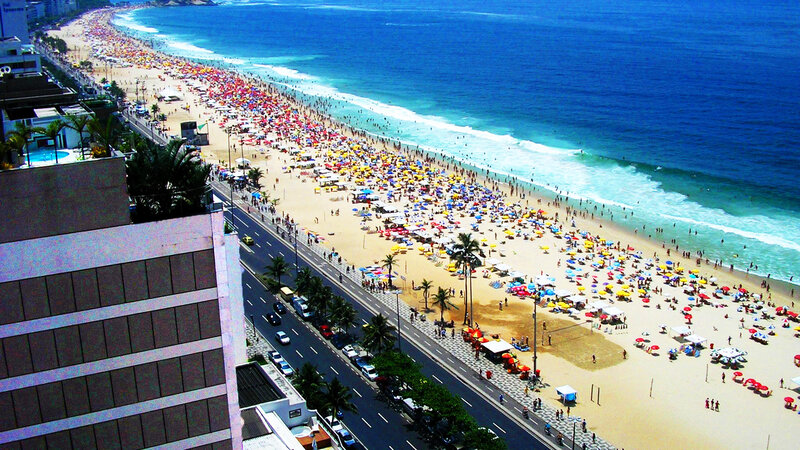 Crowded Beach with Umbrellas — Blue