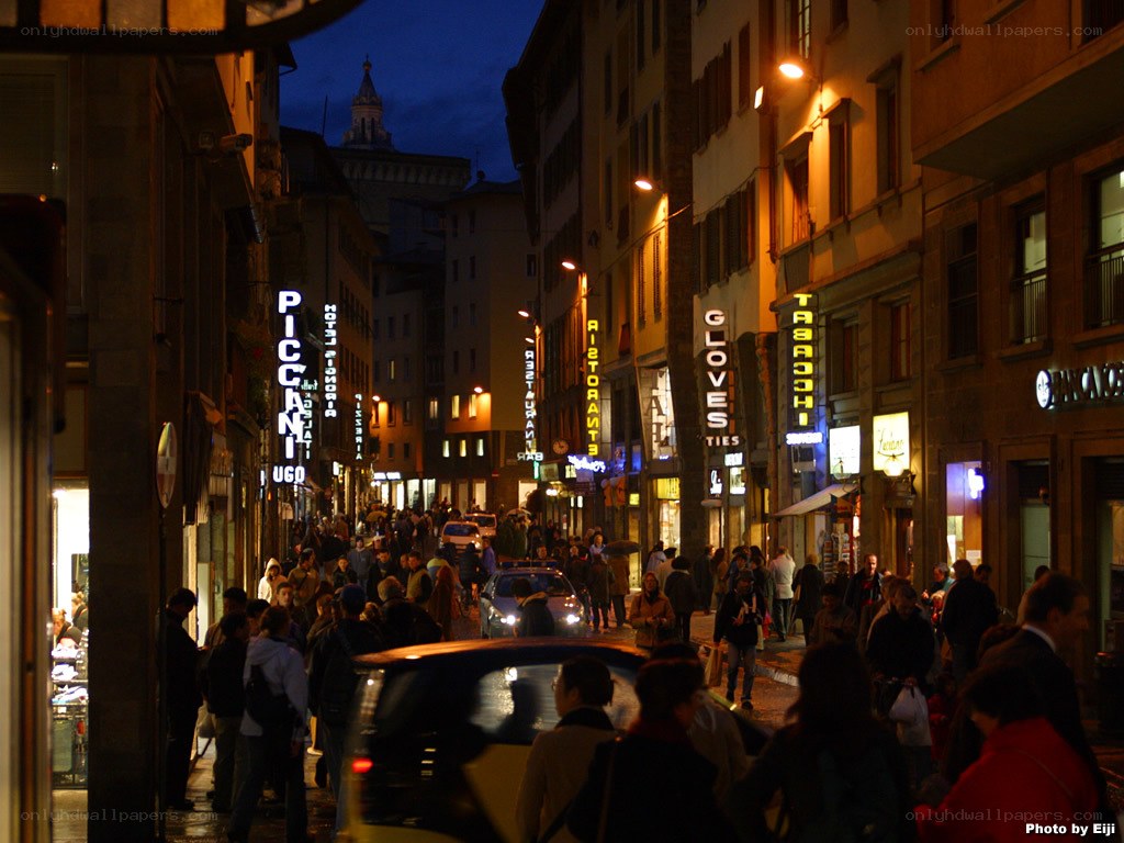 crowded street at night in florence