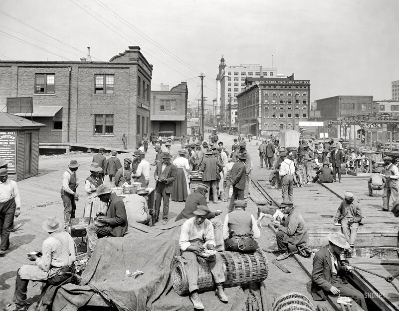 Crowded street market in early 1900s