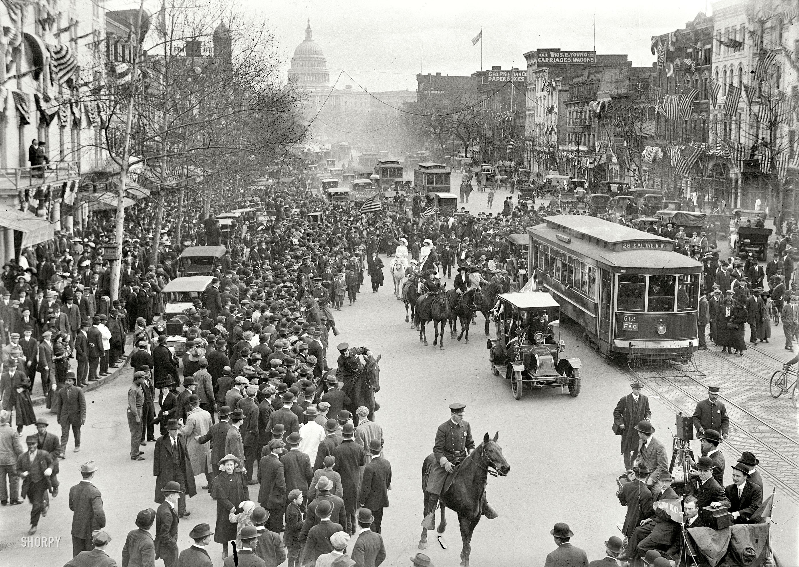 Crowded street with Capitol in background