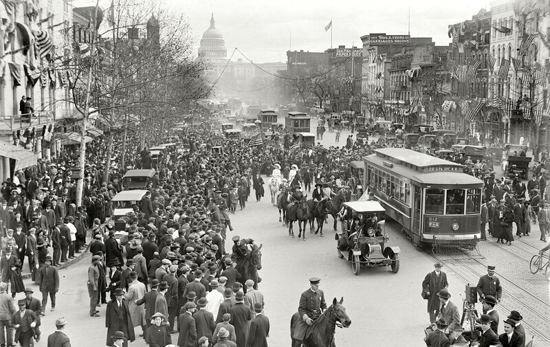 Crowded street with Capitol in background