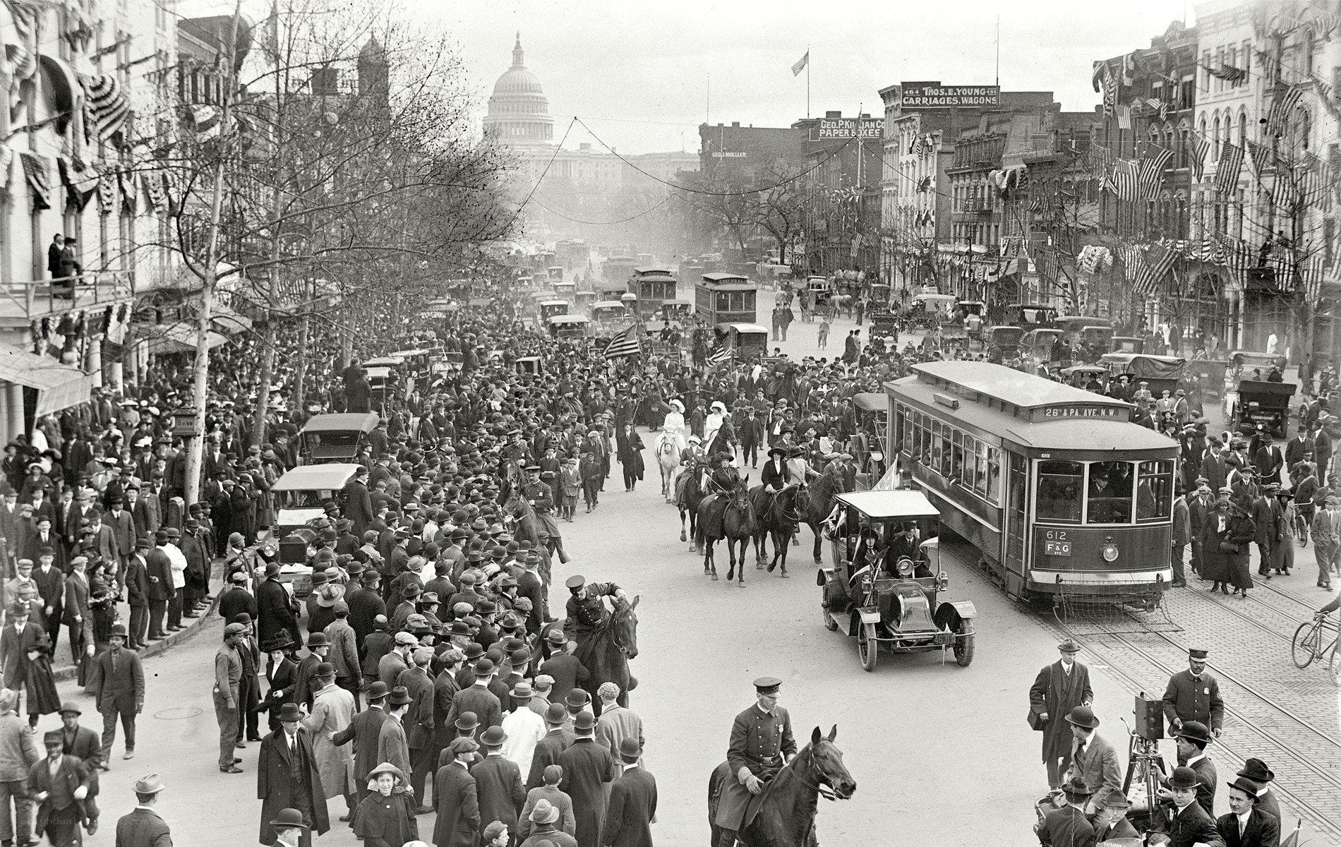 Crowded street with Capitol in background