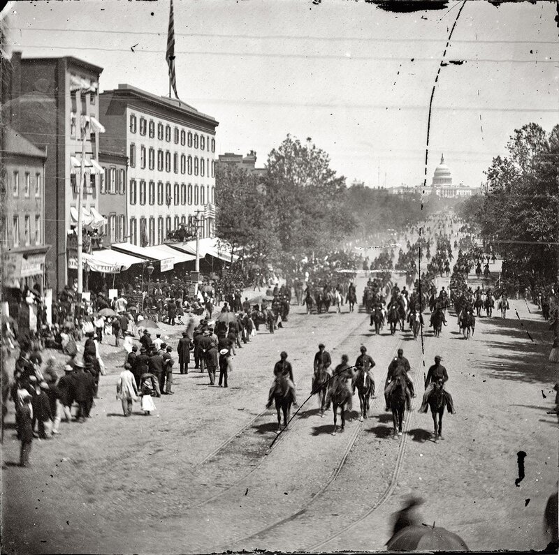 Crowded street with Capitol in distance
