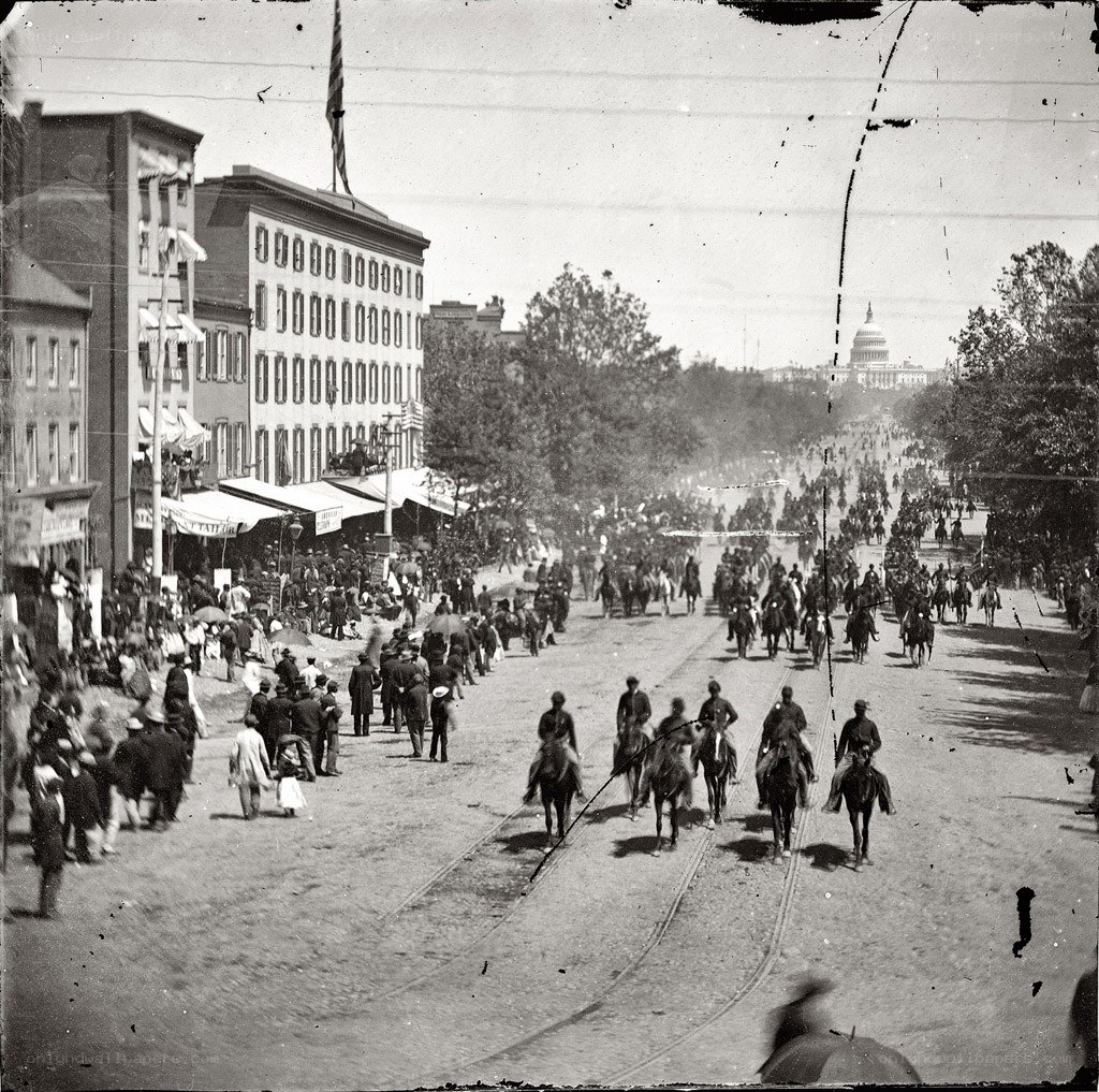 Crowded street with Capitol in distance