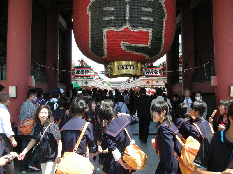 Crowded street with schoolgirls