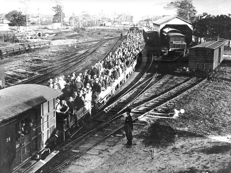 Crowded train at a railway yard