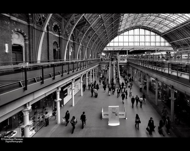 Crowded train station concourse