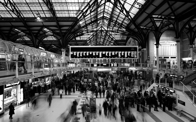 Crowded train station concourse