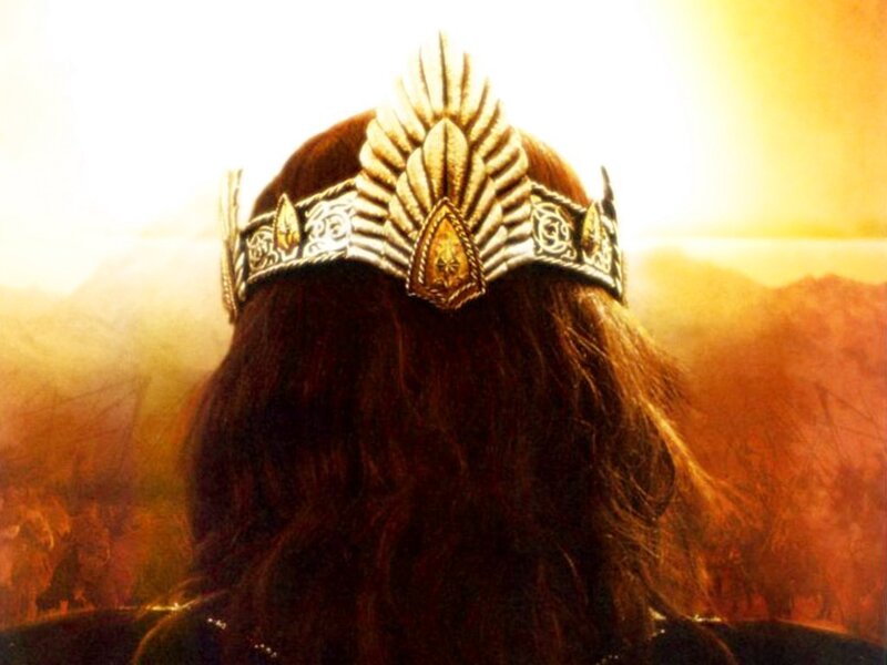 crowned figure overlooking landscape