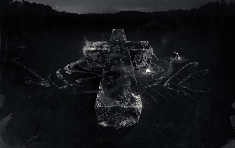 Crucifix in Dark Landscape
