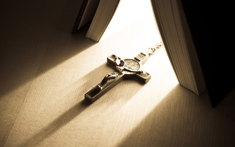 Crucifix on Book — Brown