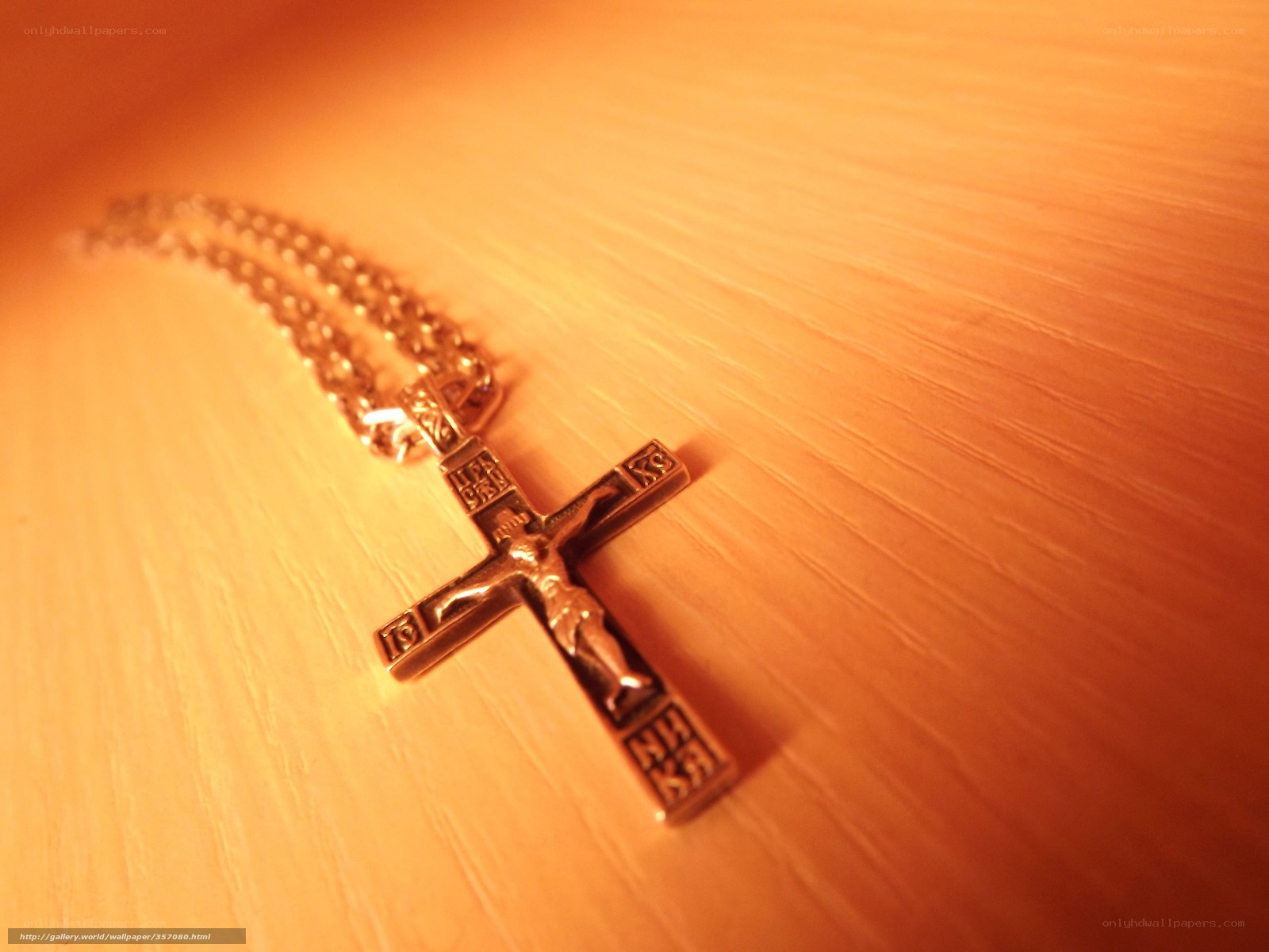 Crucifix pendant on wood