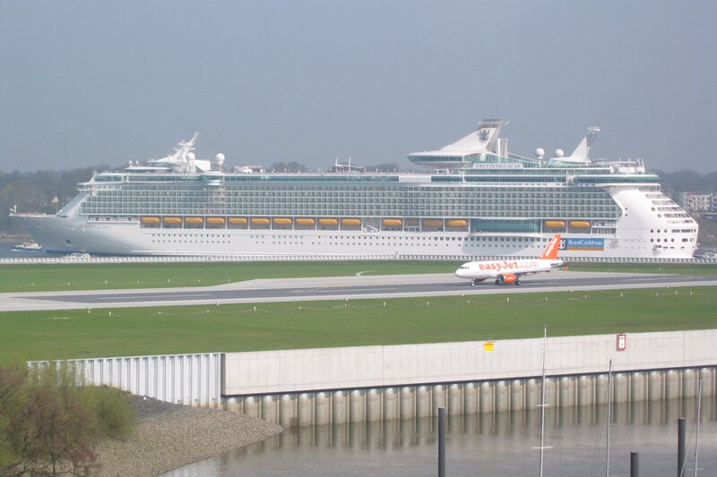 Cruise ship and airplane at airport