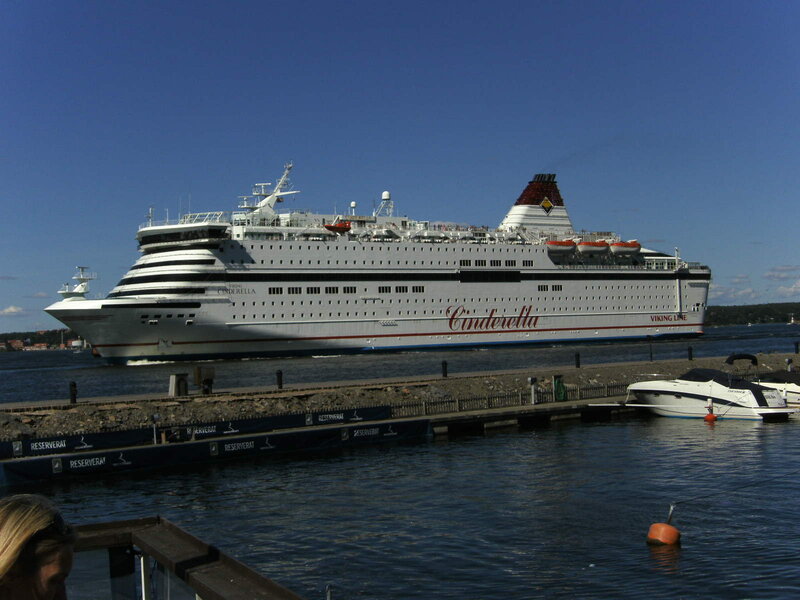 Cruise Ship at Dock — Blue, Calm, Afternoon, Photograph, Small Boat