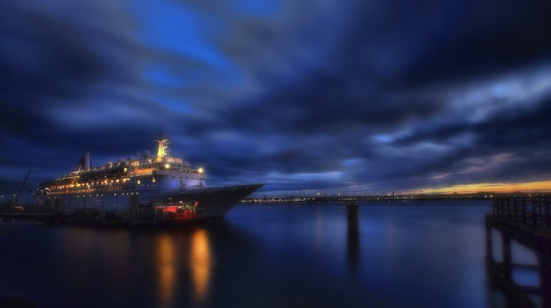 Cruise ship at dusk in harbor